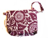 sofs offers a medium wristletin fushia wild flower