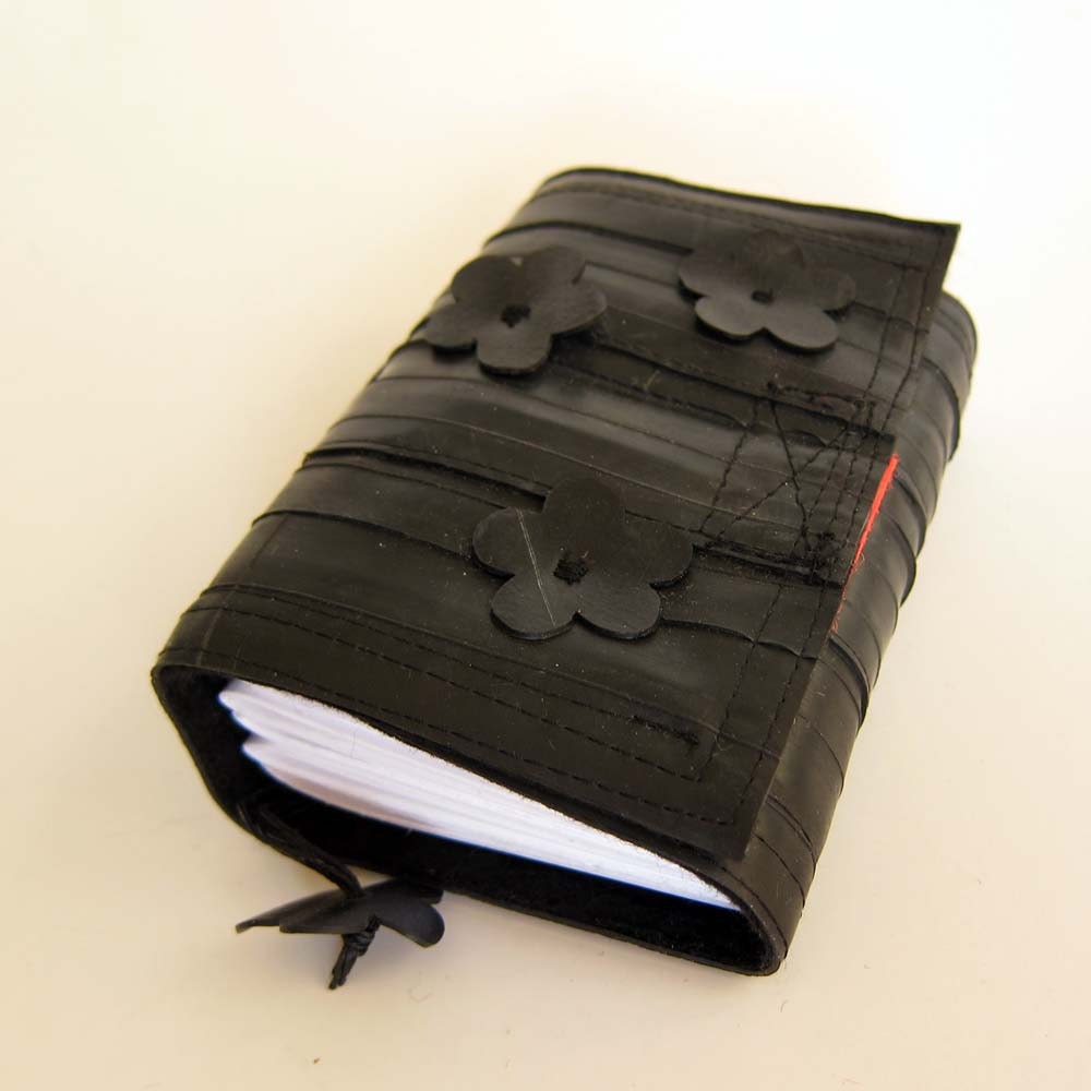 Recycled bike inner tube notebook,bound, handcut flowers, blank pages, black linen and neon orange velcro closure, small.