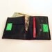 Recycled bike inner tube bifold wallet with neon green velcro closure and pink linen