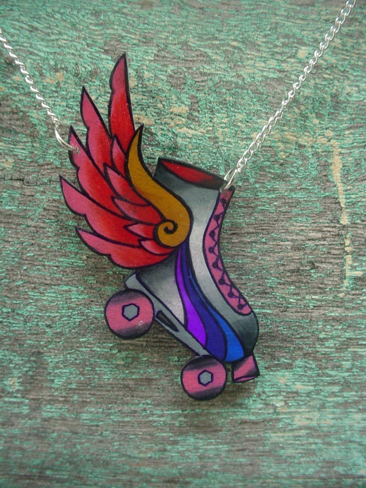 roller dreby skate with hot pink wings necklace tattoo insipired