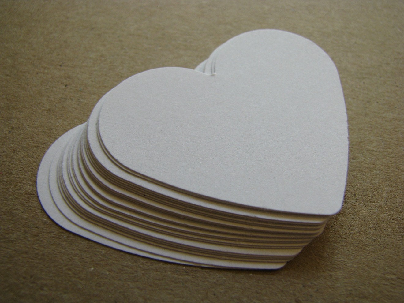 happy white paper heart cutouts