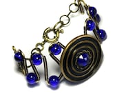 Bracelet - Victorian Era Antique button with blue faceted glass jewel Circa 1900s