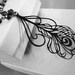Black Peacock Feather necklace - metallic peacock blue glass rondelle beads - gunmetal beaded chain
