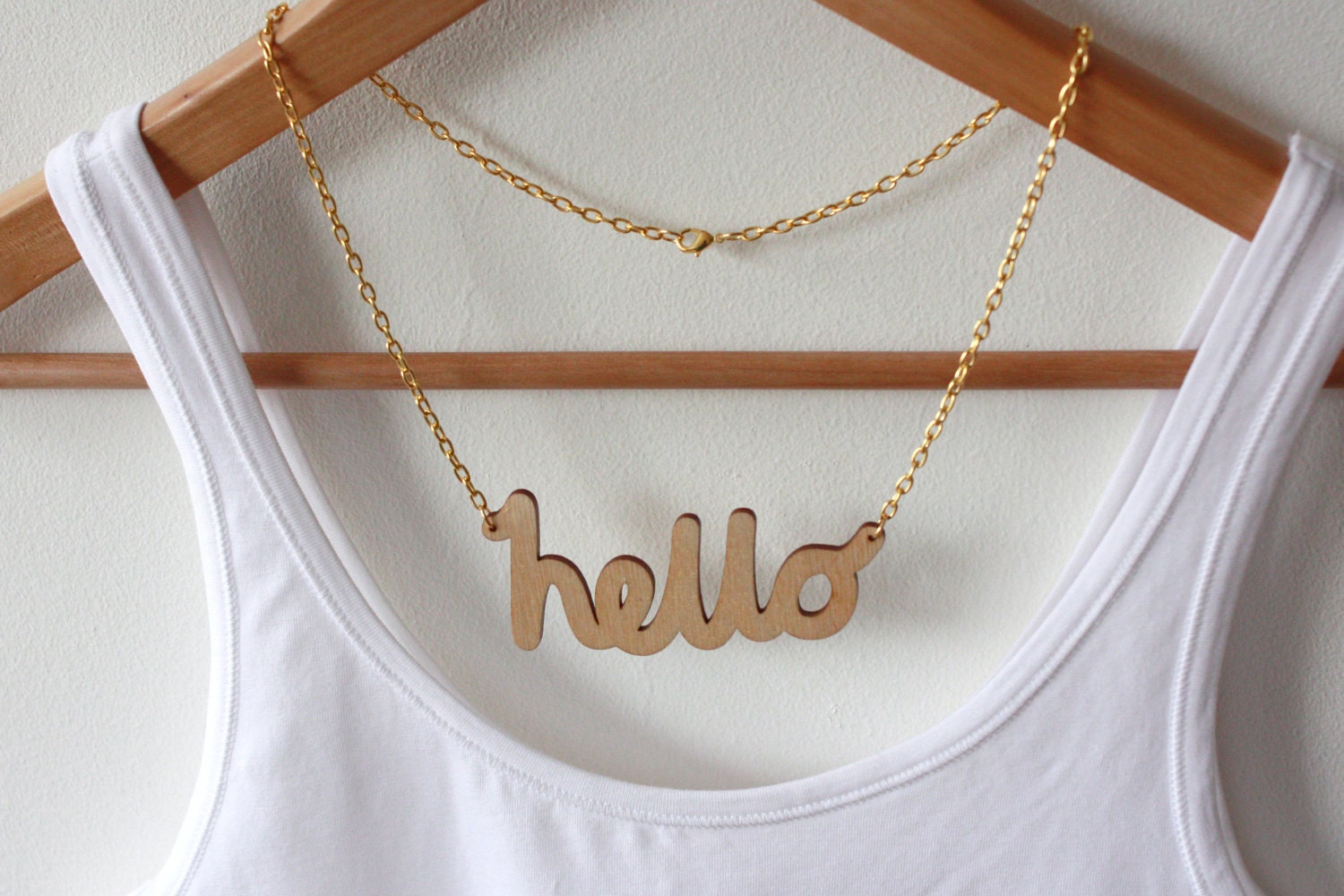 Hello Wooden Necklace. Laser cut in eco friendly birch wood. Gold or silver plated chain.