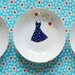 Polkadot dress in the apple tree plate
