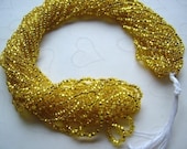 One hank of Czech transparent silver lined yellow seed beads - 0310 size 11