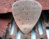 jack white. silver guitar pick