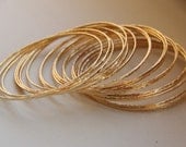 Set of 5 thin 14k gold filled hand hammered stack bangles - Eco friendly stacking bangles - bangles