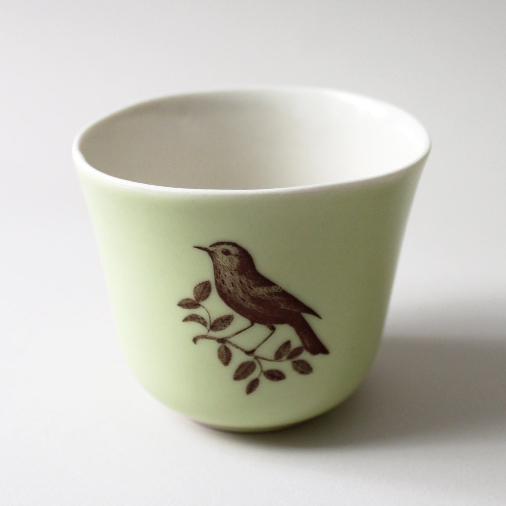 celery-green tulip cup with bird on a branch