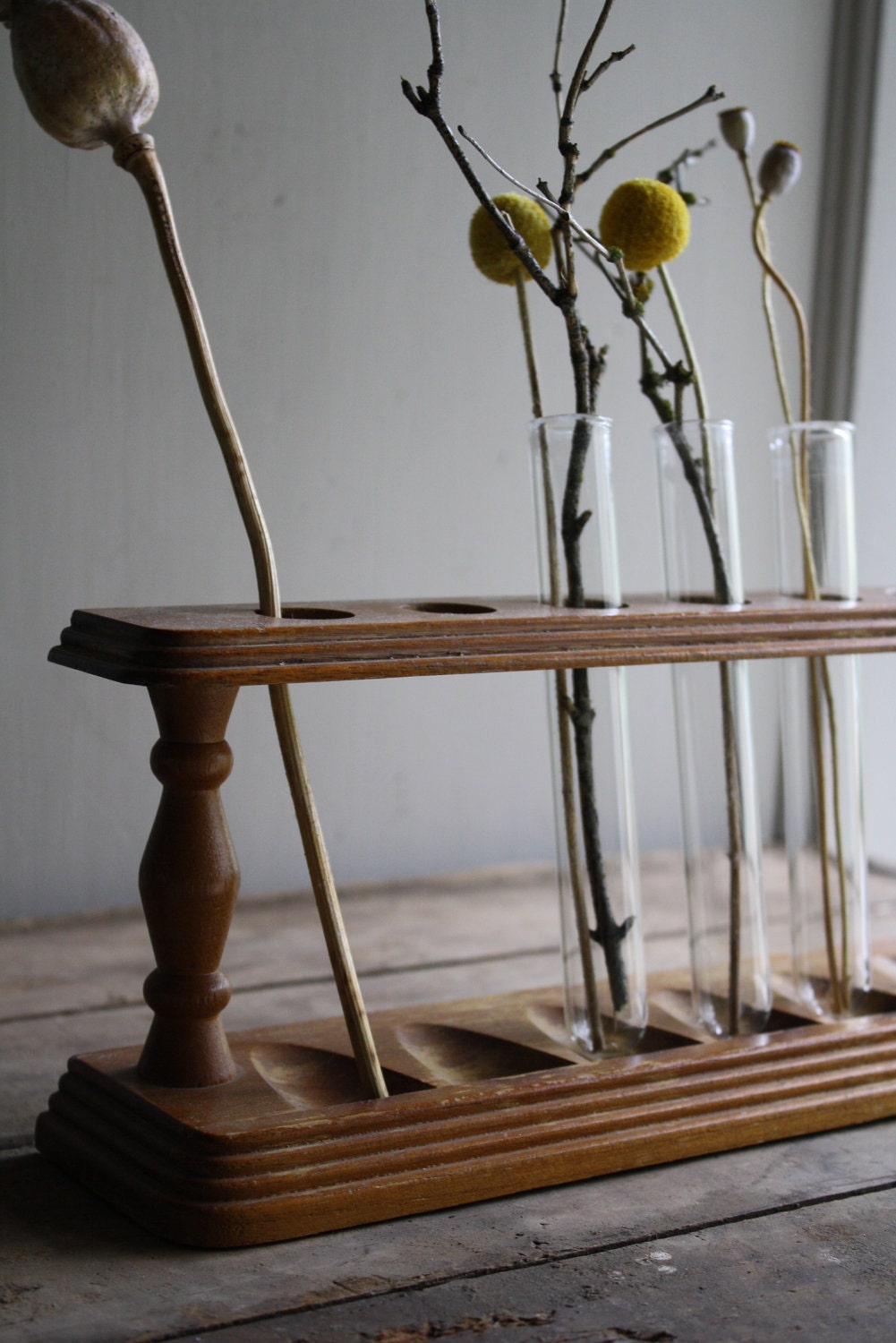 vintage wooden rack with test tubes