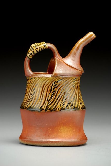 Carved Ewer, handcarved wood and soda fired