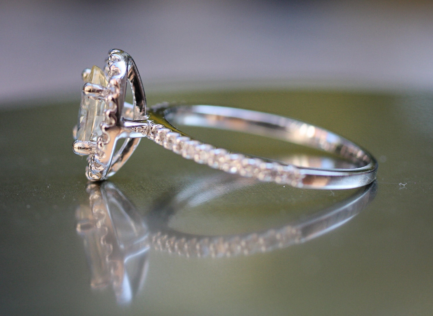 Sparkling brilliant sapphire in a 14k white gold cushion diamond setting