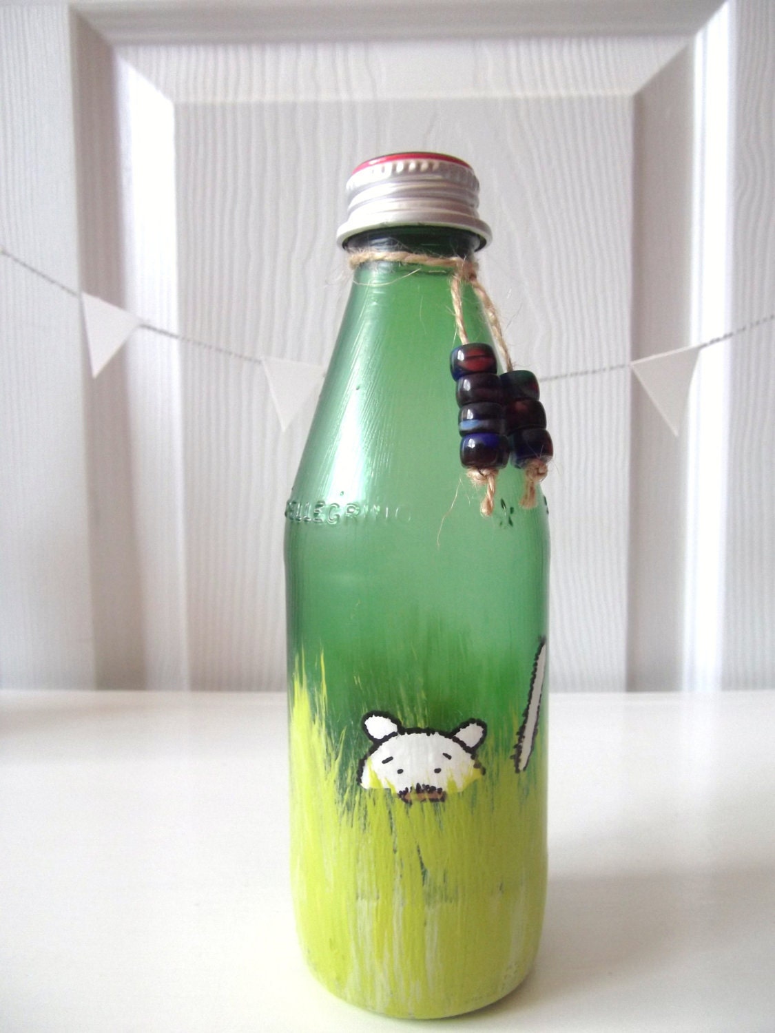 something cute in the grass / painted and embellished glass bottle