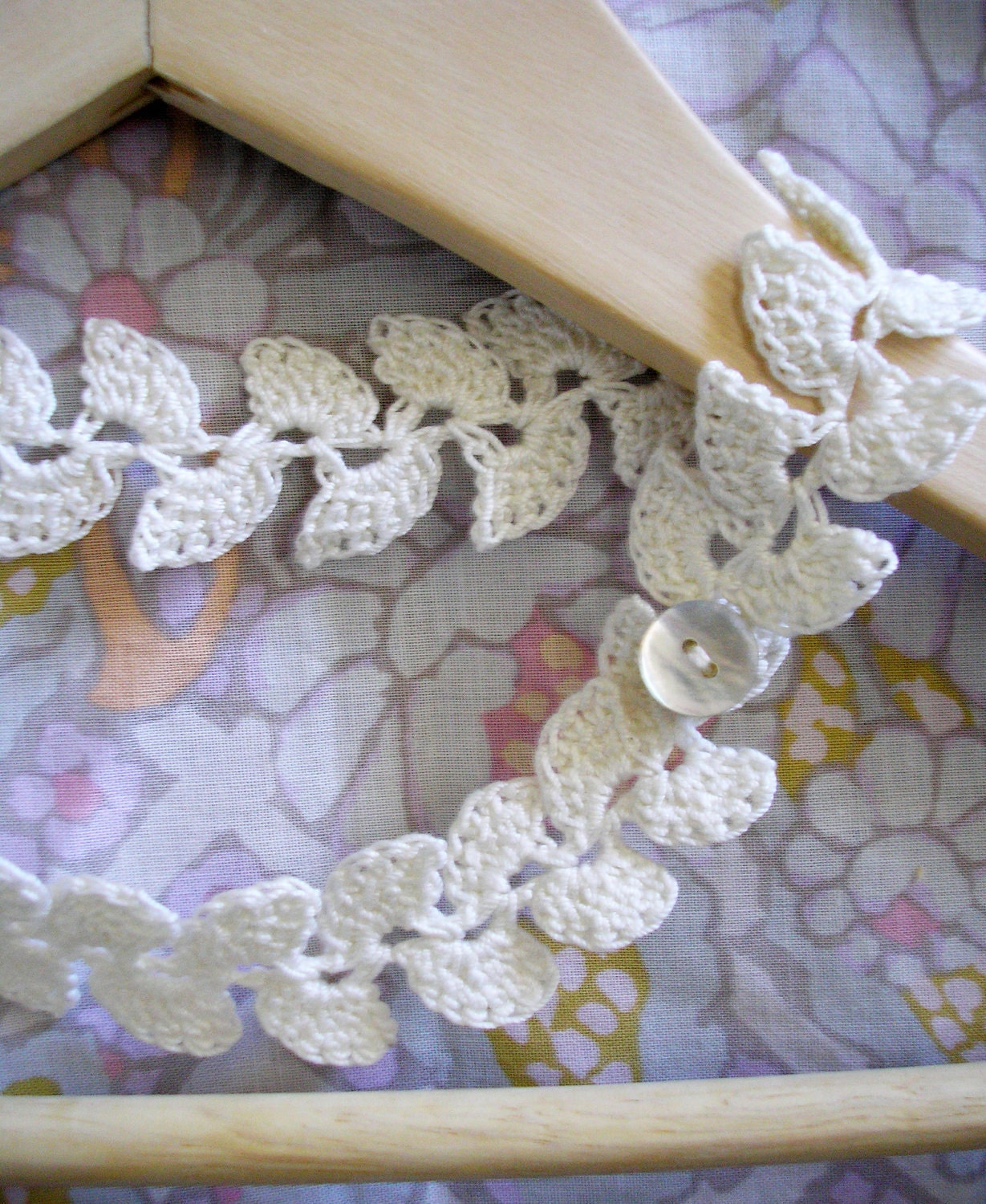 Laurel  leaf motif crochet necklace with shell button & loop fastening