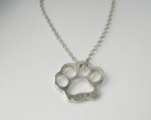 Custom sterling silver dog paw print necklace with dog's name
