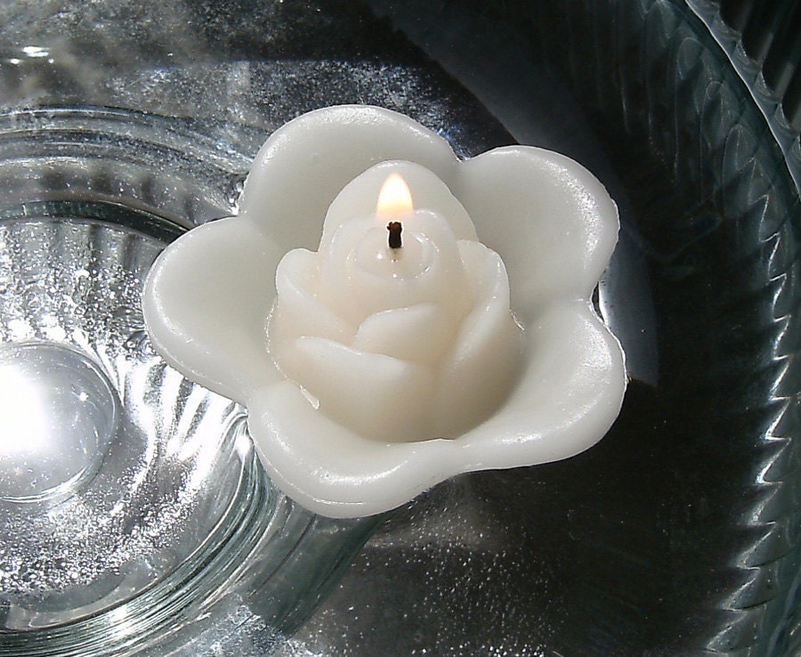 12 Ivory floating rose wedding candles for table centerpiece and reception decor.