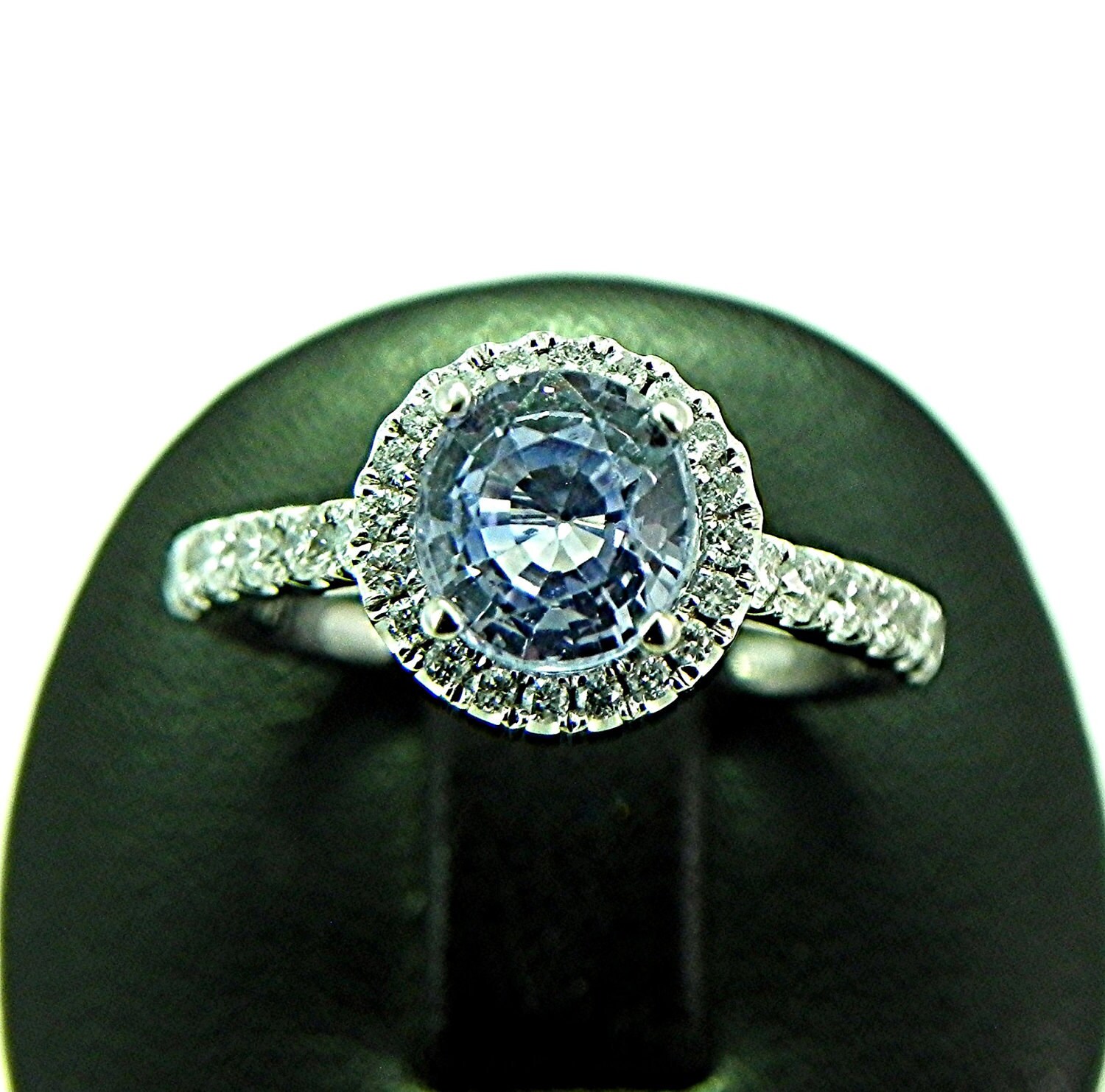 Natural Light blue Sapphire 1.30ct set in 14K white gold Halo ring with .30 carats of diamonds