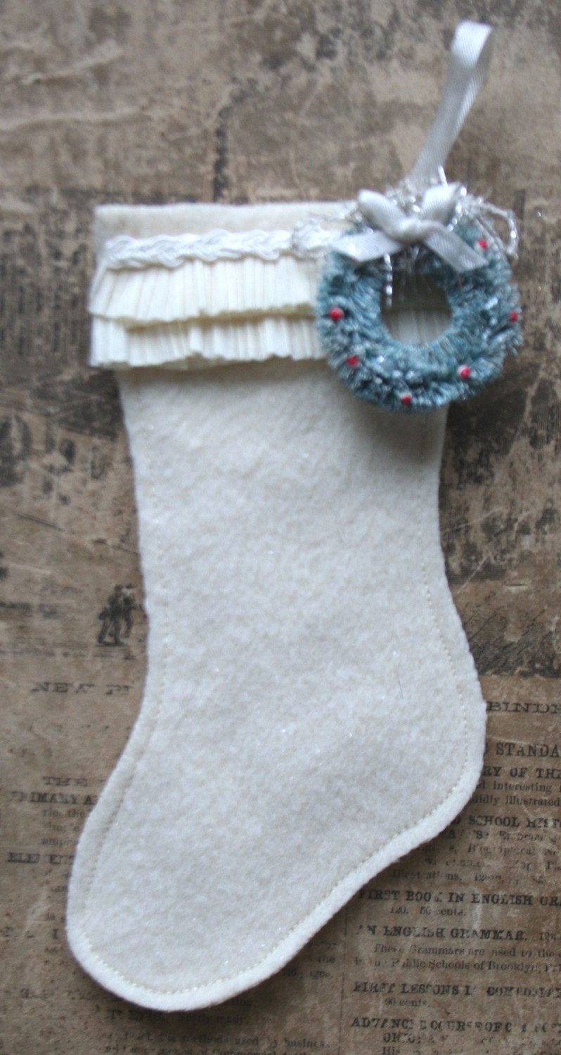 handmade ruffled wool christmas stocking with tiny bottle brush wreath