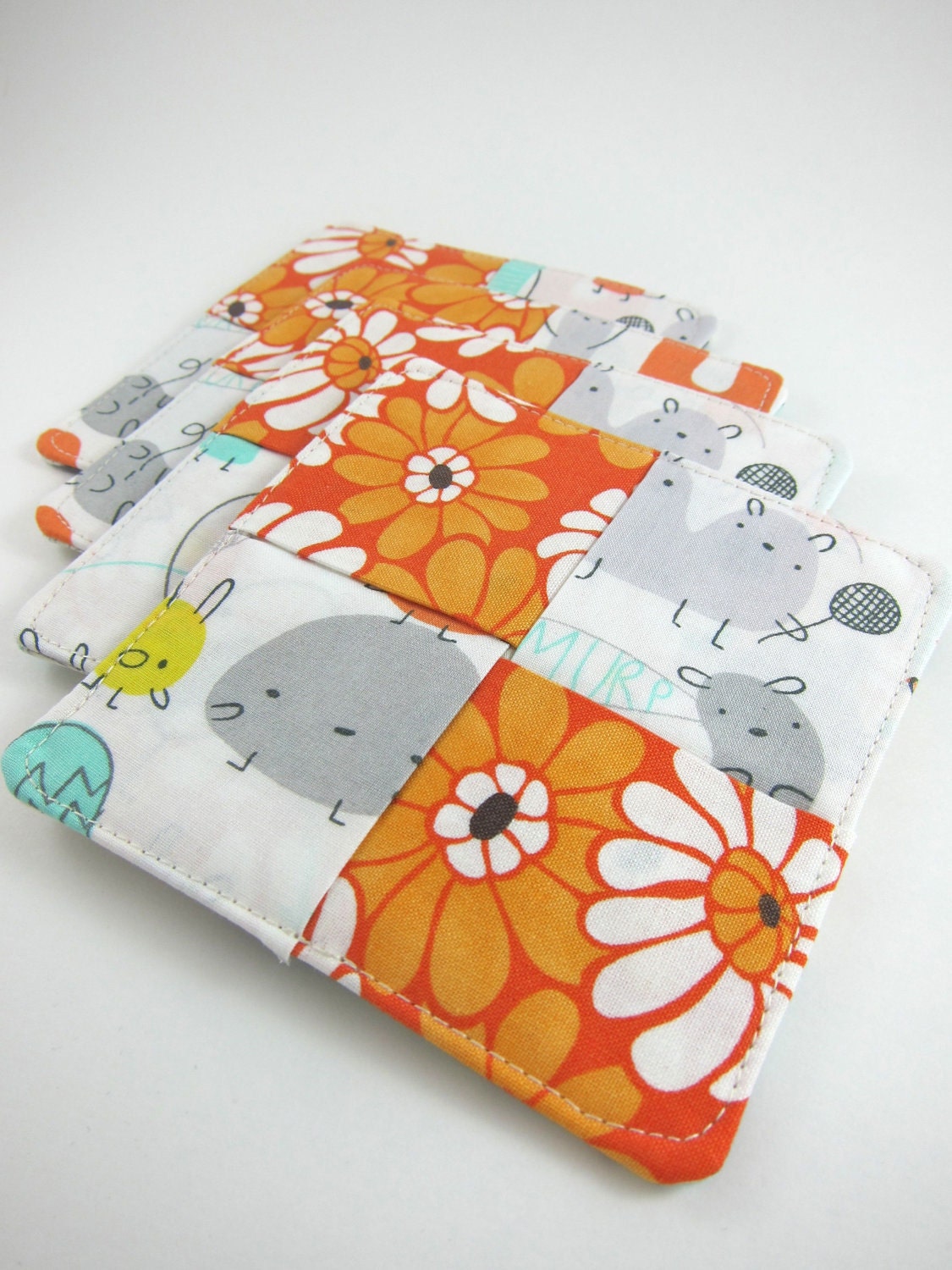 Housewarming GIft Fabric Coasters Set of 4 - Reversible with Storage Bag - Cute Monsters and Orange Flowers