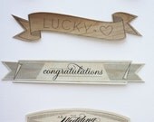 As seen in MARTHA STEWART WEDDINGS wood cake flag banner