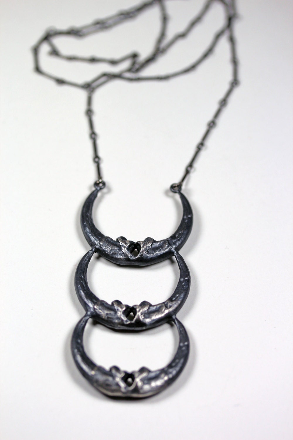 new moon. triple owl talon crescent necklace.