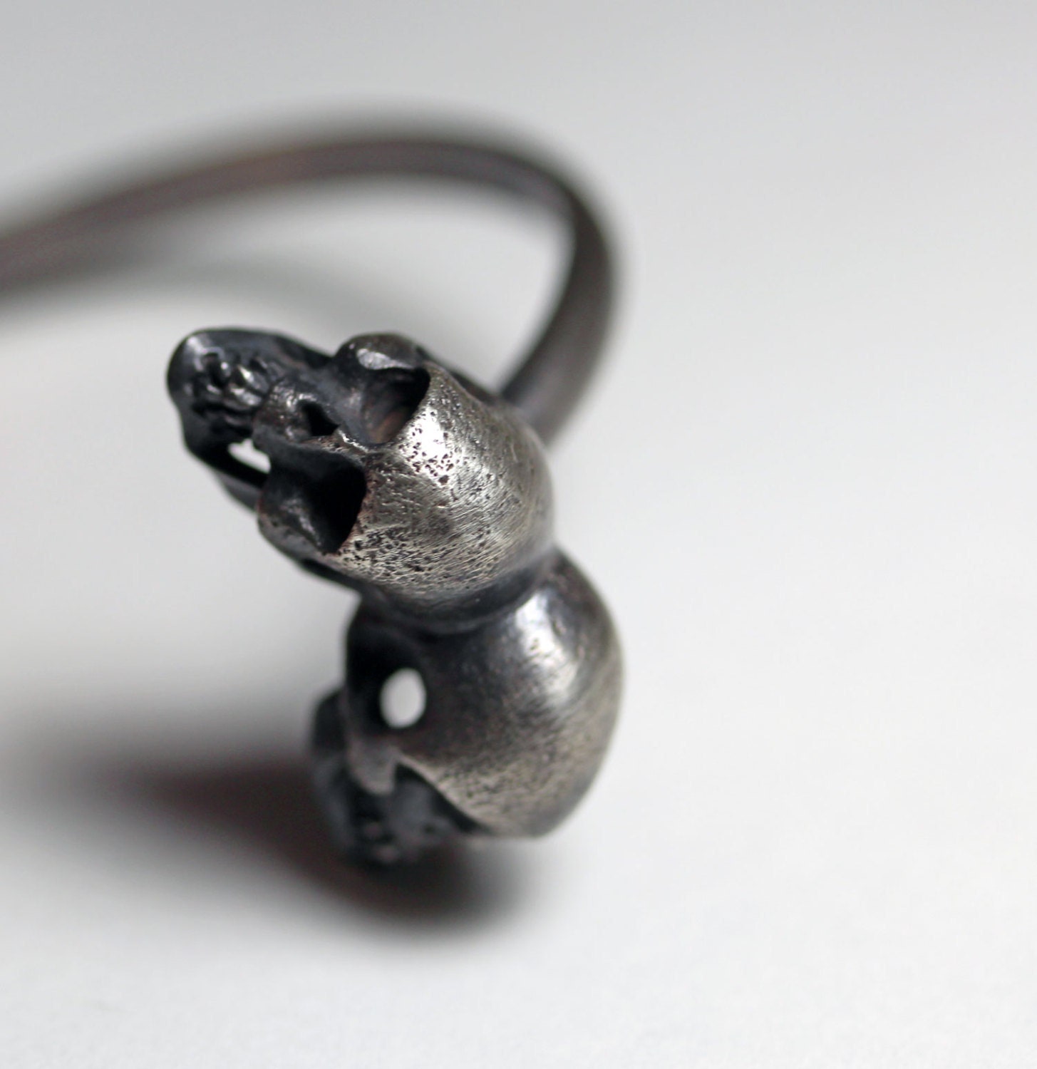 one of us. conjoined twin skull by-pass cuff.