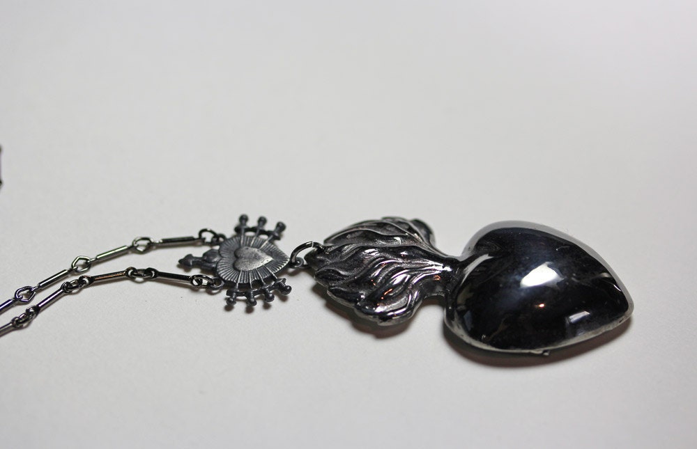 the poet's heart. reliquary locket in black silver.