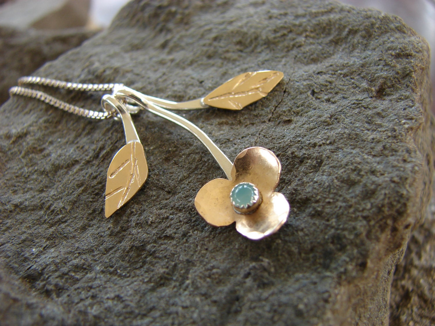 Forget Me Not flower necklace in sterling silver and gold filled with a pale aqua blue chalcedony