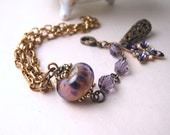 Purple bracelet  with Lampwork and vintage Cardinal  glass