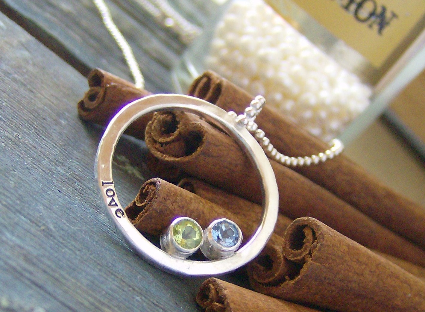 hand stamped personalized eternity ring set with faceted gem stones