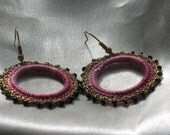 Crocheted hoop earrings with pink shades cotton yarn and gold thread with black glass beads