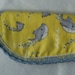 Baby Dolphin Burp Pad Cloth is handmade and perfect for the little person in your life made in the USA a blue hand crocheted edge