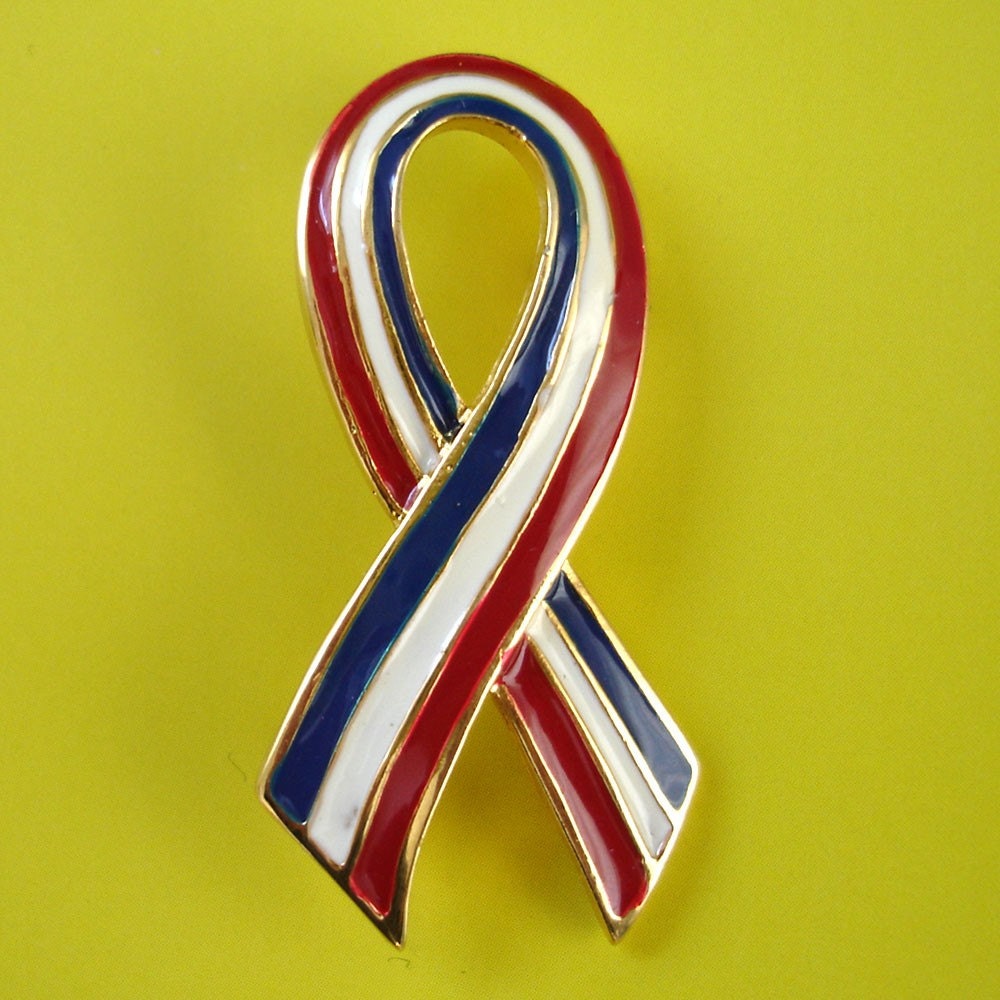 red white and blue striped ribbon brooch