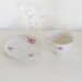 Mothers Day Sale Vintage tea cup and saucer set with pink daisies img