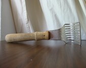 Vintage potato masher, wooden handle kitchen tool, curved metal rapid spuds smasher