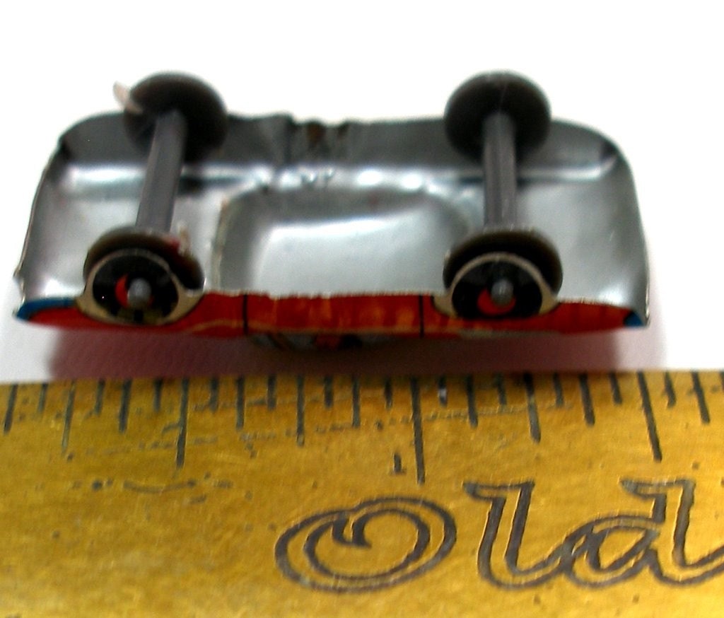 60s tin toy CAR, red with blue & yellow, from Japan.