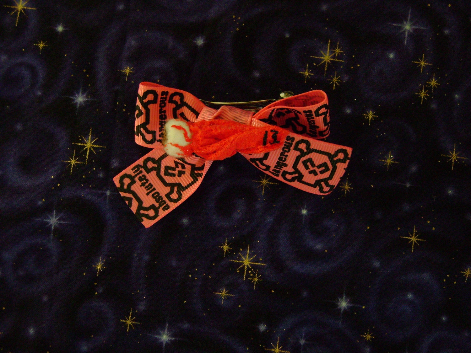 EyeBall Hair Bow On Pink Skull Ribbon says "absolutely dangerous"