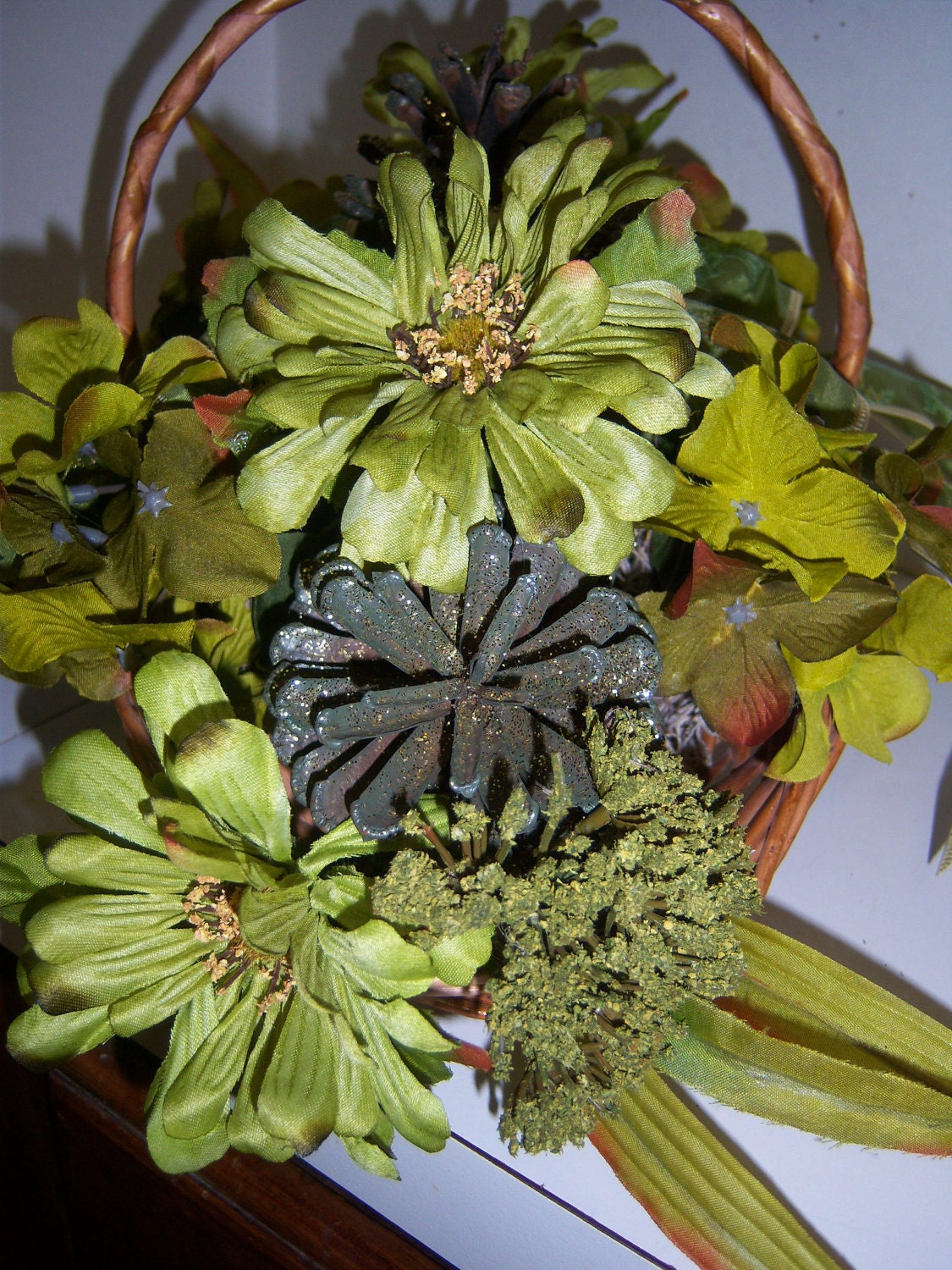 Lime Green Floral Arrangement in Basket Matching Pinecones