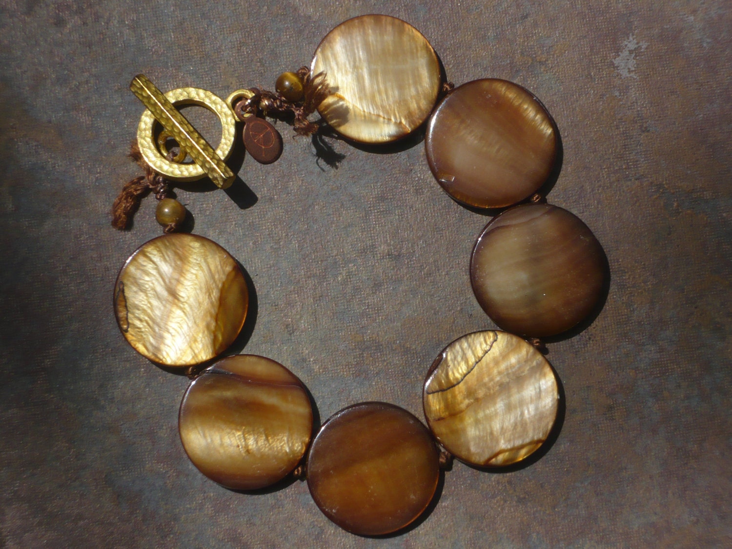 rust jet shell knotted bracelet