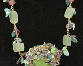 little fish-woven green and purple pendant