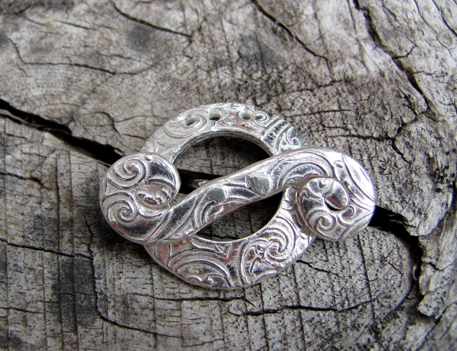 Shiny, Swirly Silver Toggle