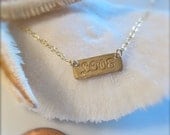 A Little Horizontal LOVE Necklace in Gold
