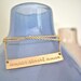 Gold Bar Necklace Inspiring Quote- "Love Conquers All"