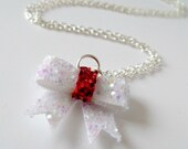 tiny iridescent white and red glitter bow necklace