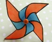 spinning pinwheel whirligig brooch pin - orange and blue