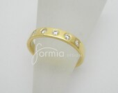 Wedding band with flush set diamonds