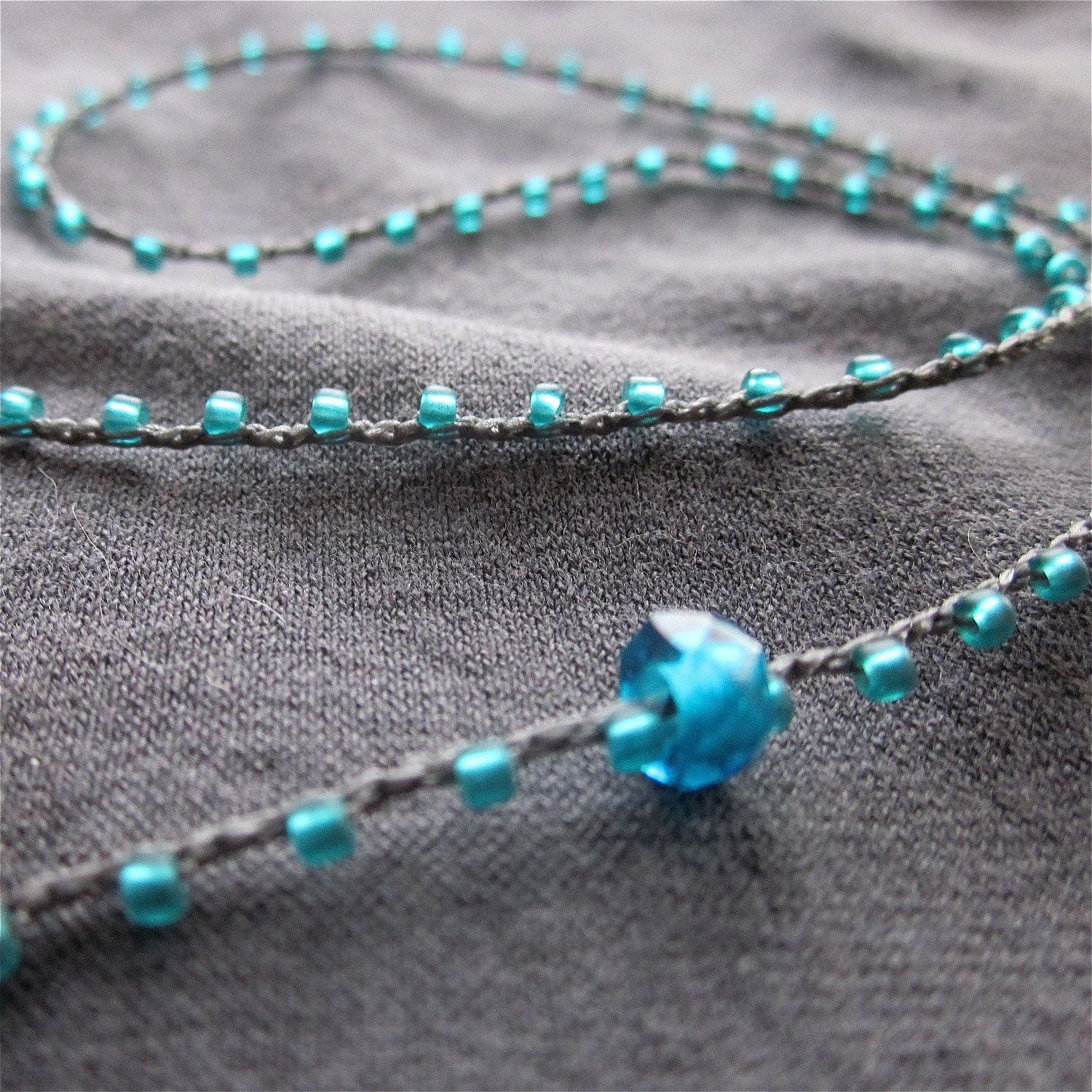 Infinity beaded crocheted necklace in blue