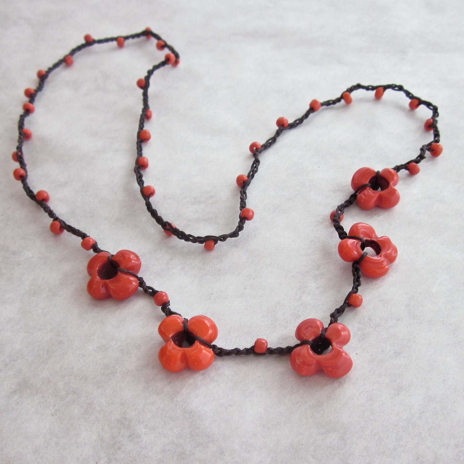 Festive Red Glass Flower beaded crocheted necklace on brown cord