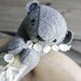 river otter gathering flowers / soft sculpture animal