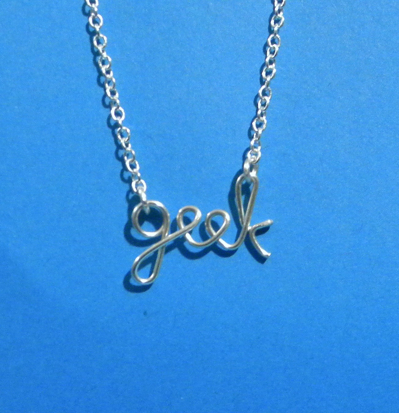 Silver wire GEEK necklace